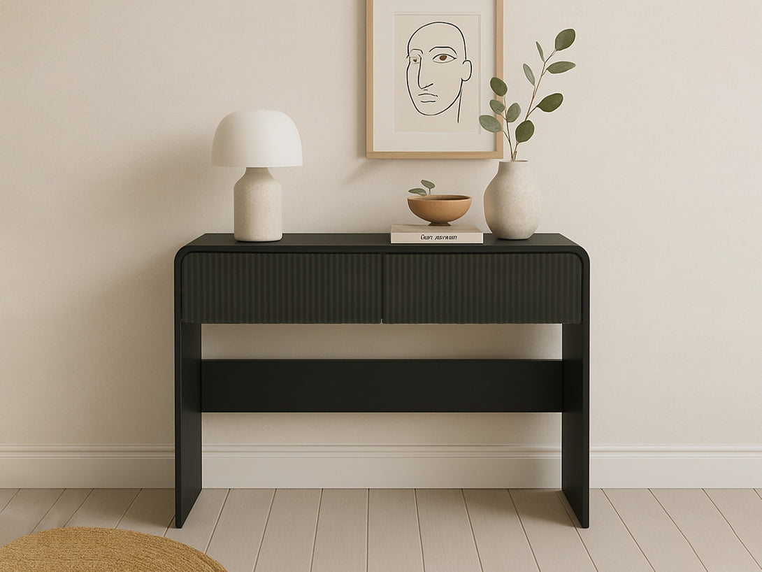 Black Cannock console table with 2 drawers, matte-painted frame, and vertical groove fronts for living spaces and hallways.