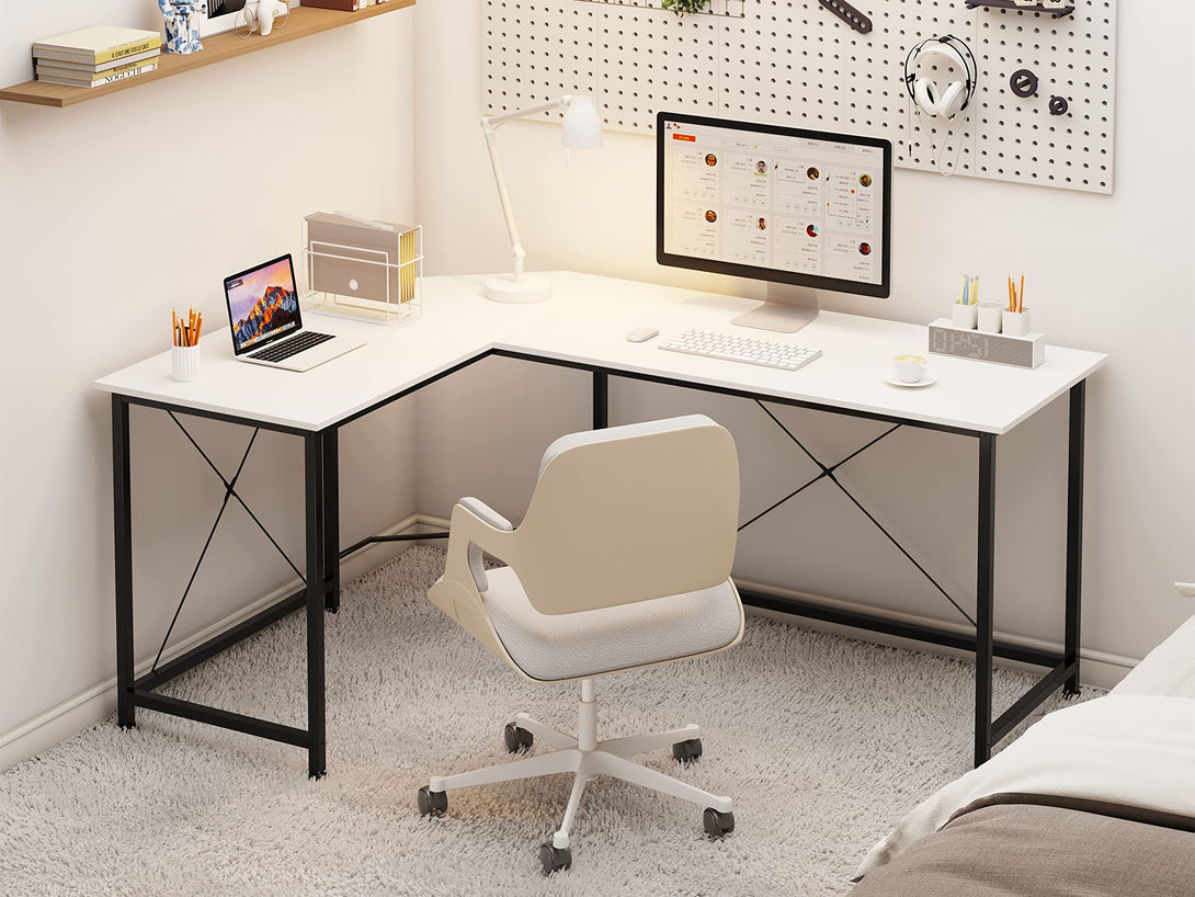 Kestrel Computer Corner Desk in white with minimalist design, L-shaped workspace, and ergonomic chair in modern office setting.